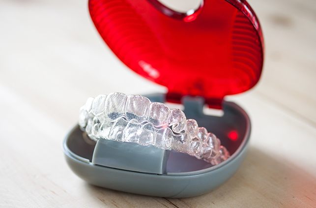 Set of Invisalign trays in carrying case