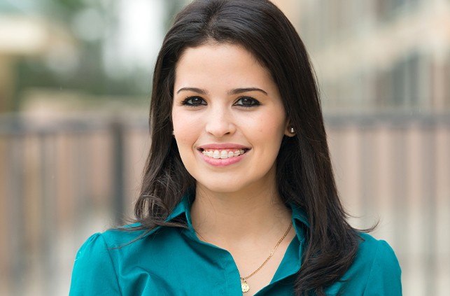 Woman with clear braces smiling