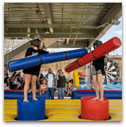 Children playing with foam sticks