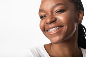 Smiling girl with traditional braces in Lawrence