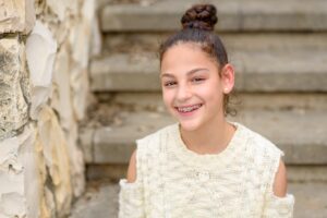 Young girl wearing metal braces